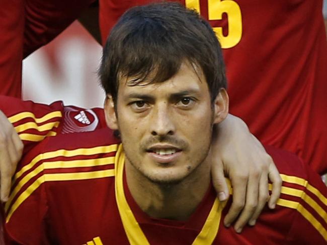 FILE - In this June 11, 2013 file photo, Spain soccer team poses prior to the start an international friendly soccer match against Ireland at Yankee Stadium in New York. Foreground from left, Pedro, Andres Iniesta, David Silva, Davis Villa, Xavi Hernadez, Jordi Alba. Background from left, Alvaro Arbeloa, Sergio Ramos, Sergio Busquets, Gerard Pique, Victor Valdes. (AP Photo/Kathy Willens, File) - SEE FURTHER WORLD CUP CONTENT AT APIMAGES.COM