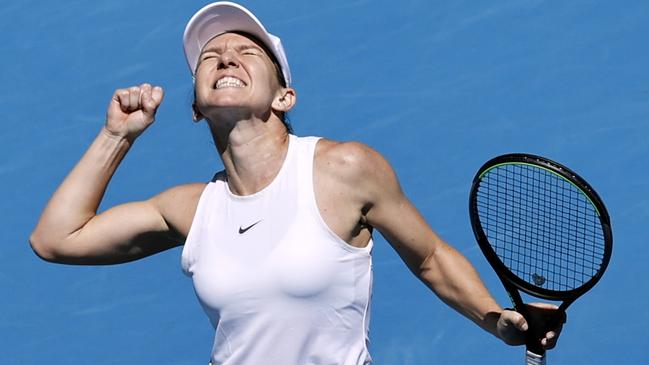 Simona Halep shows the ecstasy of victory after her easy win over Anett Kontaveit. Picture: AP