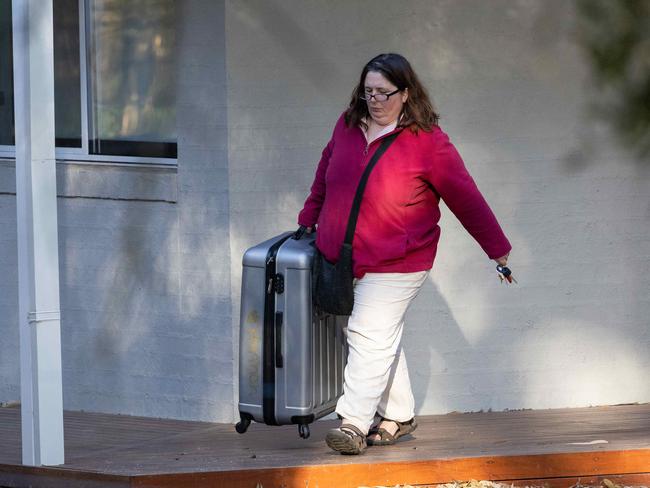 Erin Patterson leaves her Leongatha home with a suitcase. Picture: Jason Edwards