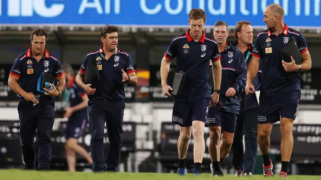 Luke Beveridge, left, leads the Western Bulldogs’ coaching staff off the ground in 2020. Picture: Michael Klein