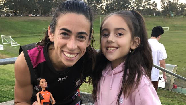 AFLW super fan Abbie Dare with Giants AFLW captain Amanda Farrugia.