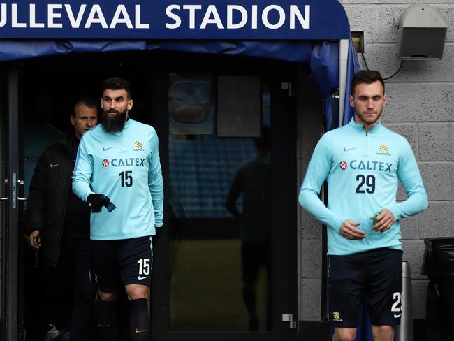 Mile Jedinak and Aleksandar Susnjar walk out for Socceroos training at Ullevaal Stadium.