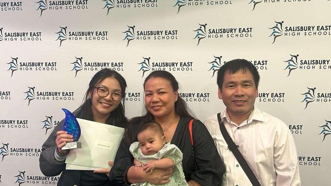 Salisbury East High School graduate Putsoriyavong Hem, 17, with mother Samnang Nay, baby sister Naomi and father Sareth Hem. Picture: Supplied.