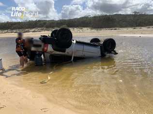 A father rescued his family after a crash on Fraser Island.