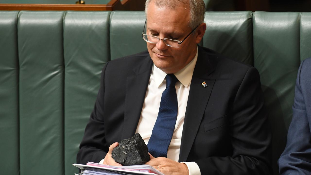 Then-Treasurer Scott Morrison gazes lovingly at a piece of coal during Question Time in February 2017. Picture: Lukas Coch/AAP Image