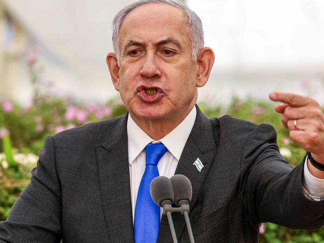 TOPSHOT - Israeli Prime Minister Benjamin Netanyahu speaks during a state memorial ceremony for the victims of the 1948 Altalena affair, at Nachalat Yitzhak cemetery in Tel Aviv on June 18, 2024. (Photo by Shaul GOLAN / POOL / AFP)