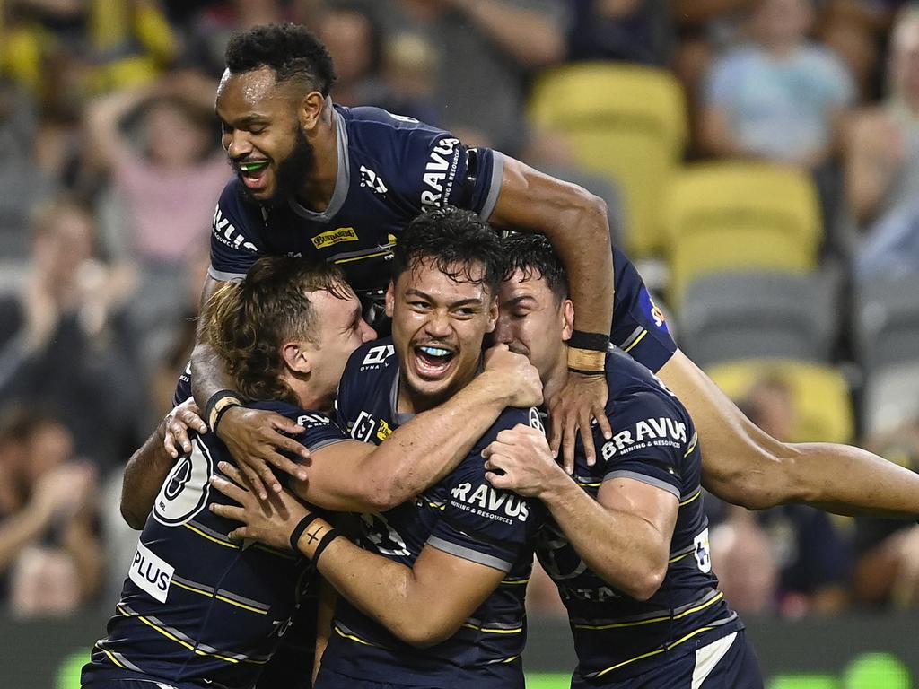 Jeremiah Nanai and his Cowboys teammates celebrate after scoring a try against the Melbourne Storm. Picture: Ian Hitchcock/Getty Images