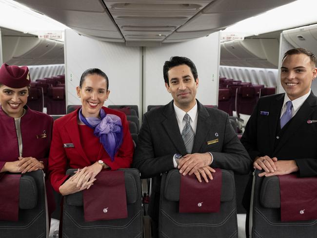 BRISBANE, AUSTRALIA - DECEMBER 04: In this image released on December 12, crew from both Virgin Australia and Qatar Airways onboard a Qatar Airways Boeing 777 at Brisbane Airport on December 04, 2024 in Brisbane, Australia. A new partnership between the two airlines has been launched which will deliver more value and choice to Australians, providing opportunities to travel to over 100 destinations across Europe, the Middle East and Africa. From December 12, Aussies can book Virgin Australia's new direct services from Sydney, Brisbane and Perth to Doha for travel from June 2025, with Melbourne set to launch later in 2025. These flights will be operated by Virgin Australia using Qatar Airways' spacious Boeing 777s, renowned for their Qsuite Business Class. (Photo by James D. Morgan/Getty Images for Virgin Australia)