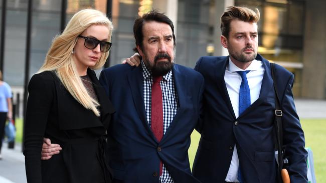 Maureen Boyce's husband Graham Boyce (centre), son Zachary Boyce and daughter Angelique Pennisi are seen leaving the Supreme Court in Brisbane in 2017. AAP Image/Dan Peled