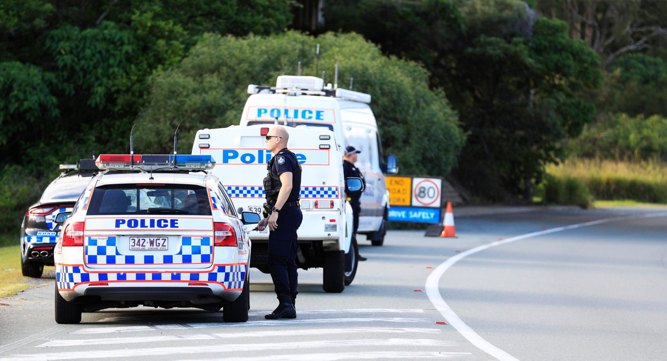 Queensland Police set up a road block due to the Corona Virus at the NSW / Queensland Border on the old Pacific Highway at Coolangatta. Photo: Scott Powick Newscorp