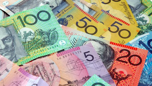 Australian notes scattered on a table. Click to see more...  Picture: istock