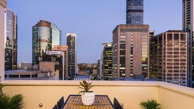 The balcony offers views of the skyline and glimpses of the Brisbane River while there is direct access to the pool area. Picture: Place