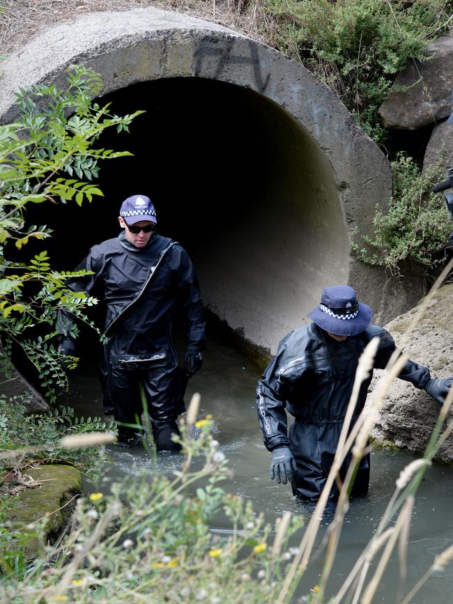 Police in Darebin Creek. Picture: Andrew Henshaw