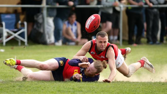 John Ryan of Diggers Rest is brought down in a tackle by Wally Saad of Romsey. Picture: Mark Dadswell