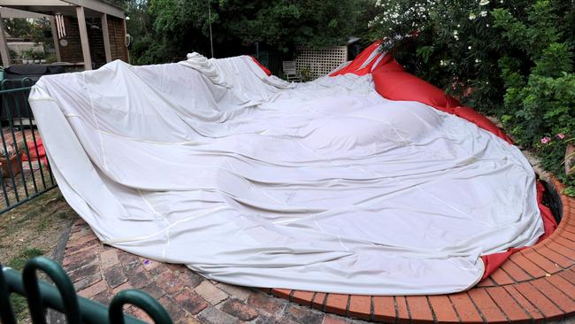 The balloon takes a dip in the Taylors’ swimming pool. Picture: Andrew Henshaw