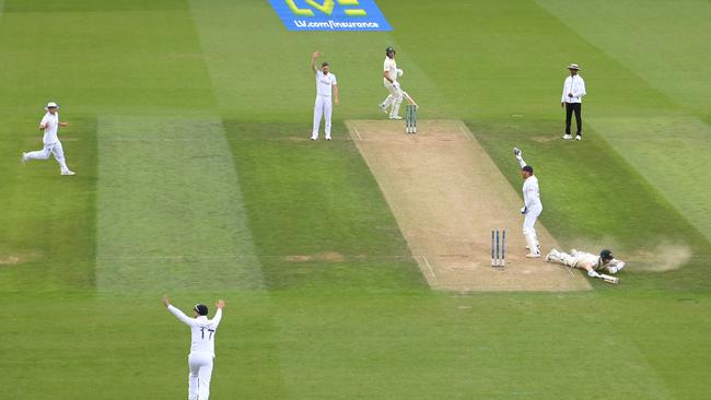 England wicketkeeper Jonny Bairstow runs out Steve Smith from a throw from George Ealham but the decision is reversed after review. Picture: Getty Images