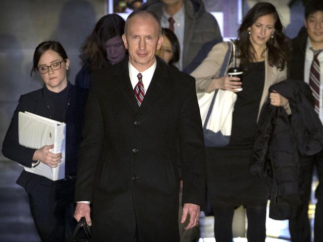 Deputy U.S. trade representative Jeffrey D. Gerrish, center, leaves his hotel in Beijing, Tuesday, Feb. 12, 2019. The U.S. delegation led by Gerrish began trade negotiations on Monday ahead of U.S. Treasury Secretary Steven Mnuchin and Trade Representative Robert Lighthizer who will arrive later this week to hold a new round of high-level trade talks with China on Feb. 14-15. (AP Photo/Mark Schiefelbein)