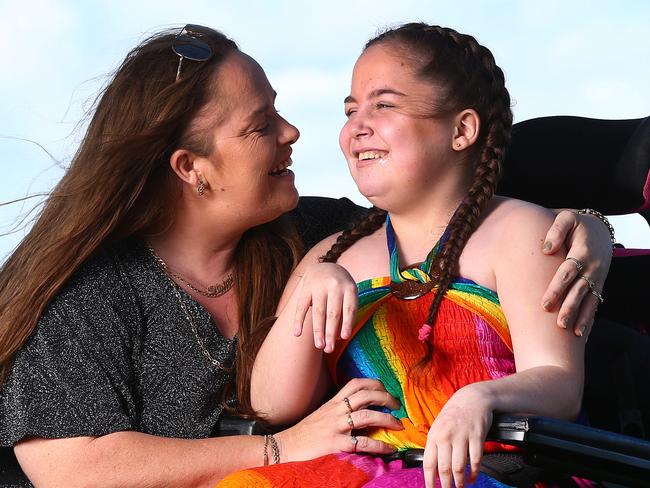 Kaitlyn Spraggon, who suffers from a severe disability, and her mother Katrina, who has claimed that her daughter was told there would be no graduation ceremony for Year 6 students at Caboolture Special School, and then later found out there was one. They are holidaying on the Gold Coast. Pics Adam Head
