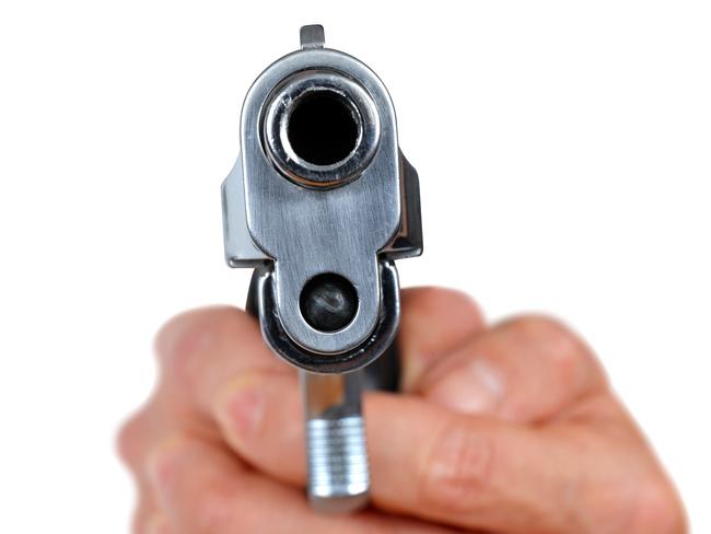 A man has been arrested for allegedly pointing a replica gun at a woman at a Darwin bus stop.