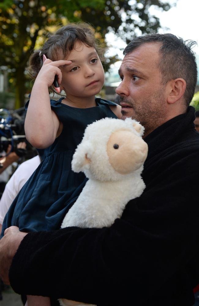 Michael Paramasivan and his daughter Thea Kavanagh, 5, who escaped the fire. Picture: Victoria Jones/PA Wire