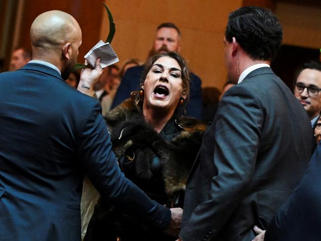 Australian Senator Lidia Thorpe stages a protest as Britain's King Charles and Queen Camilla attend a Parliamentary reception in Canberra, Australia - 21 Oct 2024. Victoria Jones/Pool via REUTERS TPX IMAGES OF THE DAY