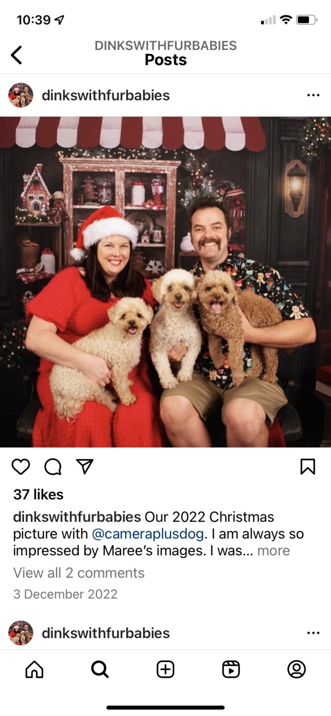 Belle and her husband Kendall with their dogs.