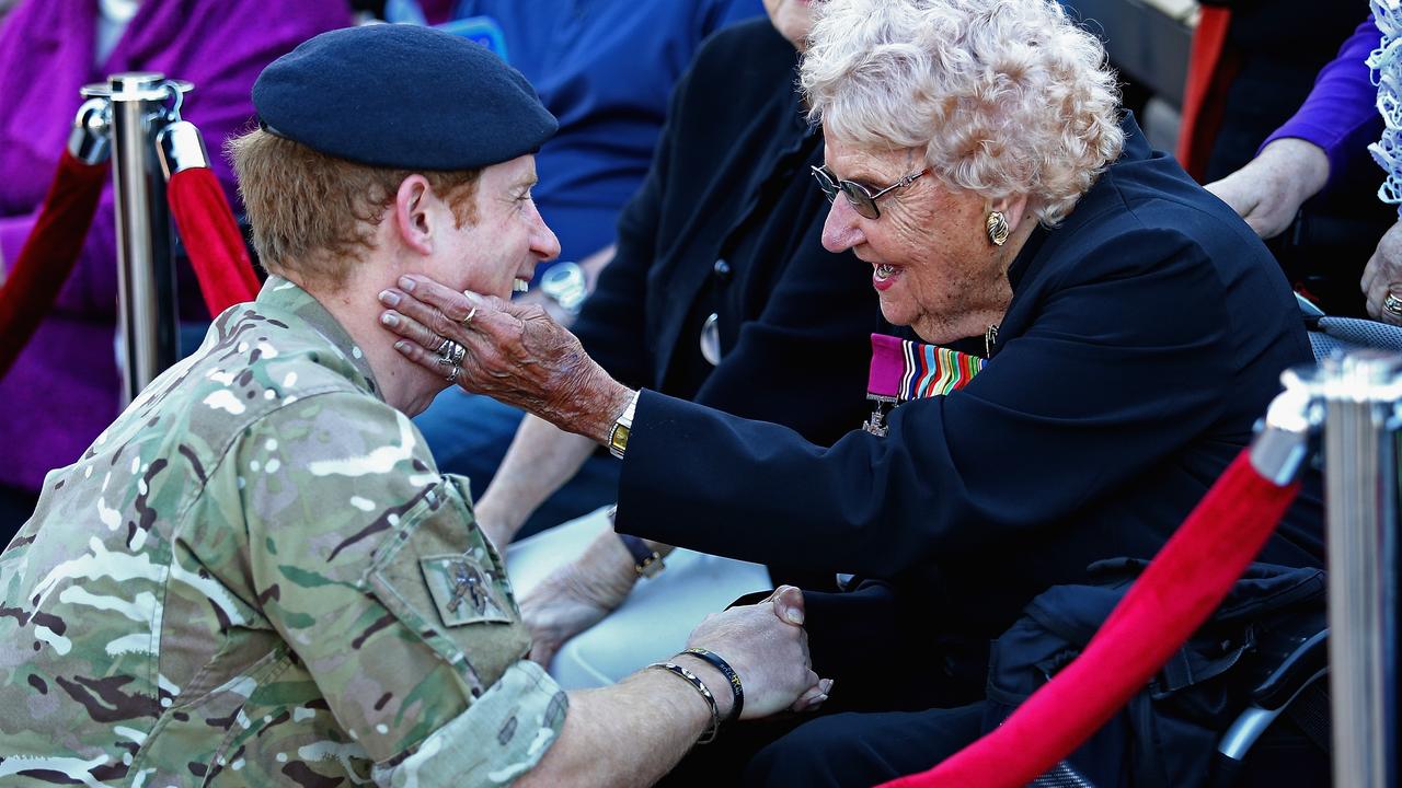 Prince Harry first met Daphne Dunne May 7, 2015 in Sydney, after spotting the Victoria Cross medal she wore on her coat. Mrs Dunne also served as a corporal in the Australian Women’s Army Service during WWII. Picture: Getty