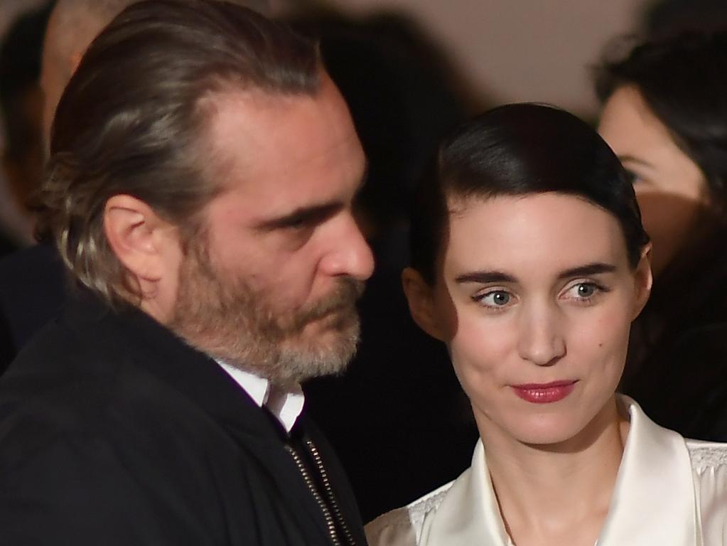 The notoriously private Phoenix with his “wife”, Rooney Mara. Picture: AFP Photo/Angela Weiss