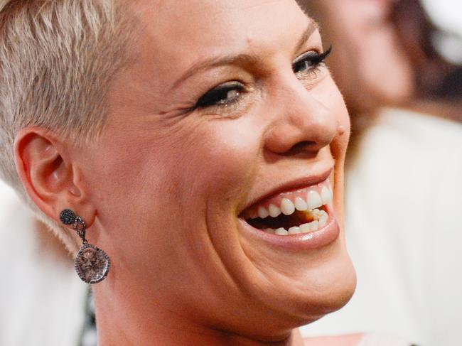 FILE - In a Dec. 10, 2013 file photo, singer Pink arrives at the Billboard Women In Music Awards in New York. A mom’s decision to take her 11-year-old daughter to a Pink concert has a judge saying, “so what?” NJ.com (http://bit.ly/1ORX2UR) reports the girl’s parents are divorced, and her father accused his ex-wife of abusing her parental discretion by taking their daughter to the December 2013 concert at the Prudential Center in Newark. But state Superior Court Judge Lawrence Jones rejected the complaint (Photo by Evan Agostini/Invision/AP, File)