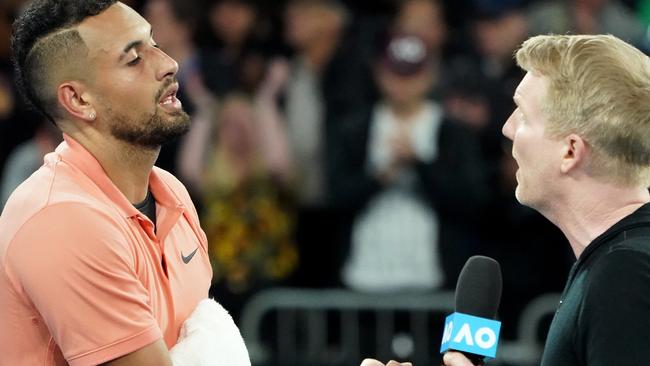 Nick Kyrgios is interviewed by Jim Courier at the Australian Open last year. (AAP Image/Dave Hunt)