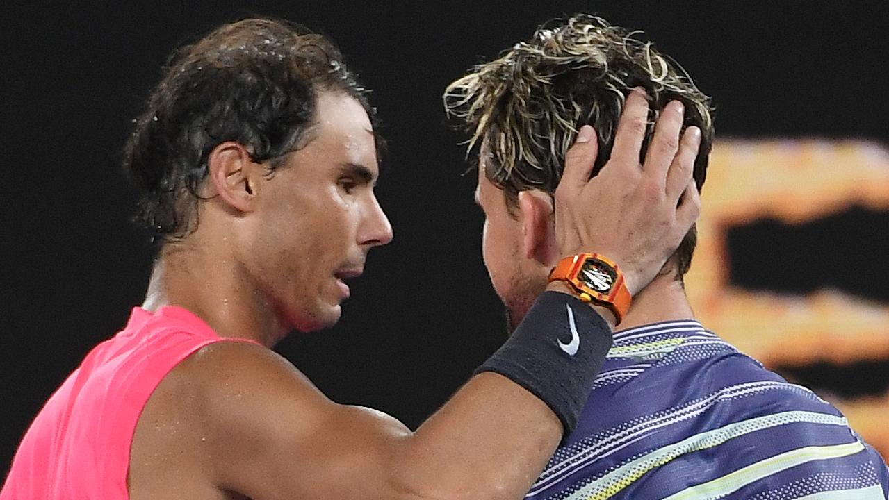 Rafael Nadal congratulates Dominic Thiem after their Australian Open quarter-final. (Photo by William WEST / AFP)
