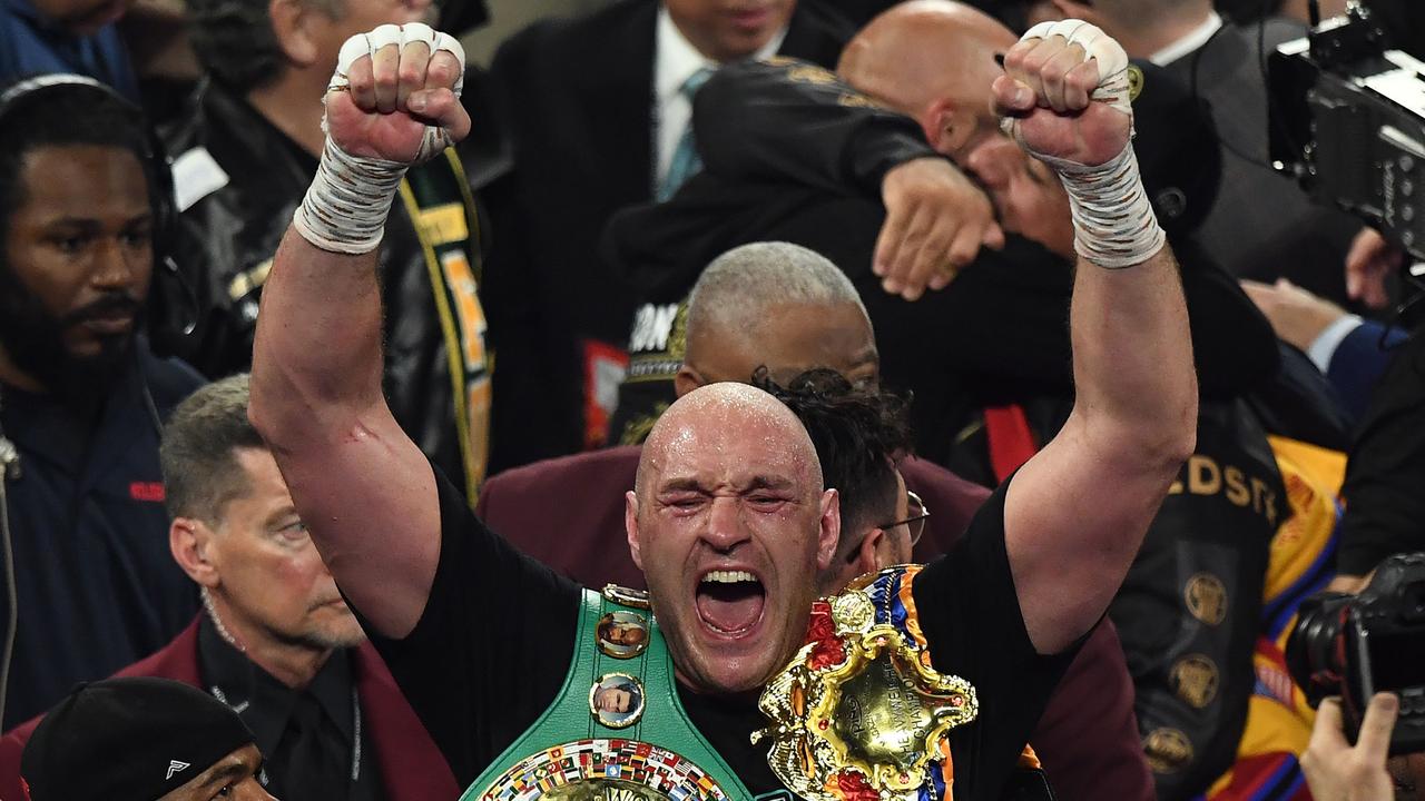 Tyson Fury celebrates after his win over Deontay Wilder. (Photo by Mark RALSTON / AFP)
