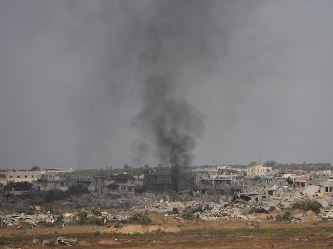 Smoke rises following an Israeli army bombardment in Khan Younis, Gaza, as seen from southern Israel, Monday, May 19, 2025. (AP Photo/Ohad Zwigenberg)