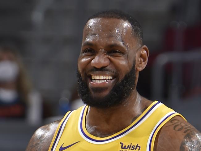 CLEVELAND, OH - JANUARY 25: LeBron James #23 of the Los Angeles Lakers smiles during the game against the Cleveland Cavaliers on January 25, 2021 at Rocket Mortgage FieldHouse in Cleveland, Ohio. NOTE TO USER: User expressly acknowledges and agrees that, by downloading and/or using this Photograph, user is consenting to the terms and conditions of the Getty Images License Agreement. Mandatory Copyright Notice: Copyright 2021 NBAE (Photo by David Liam Kyle/NBAE via Getty Images)