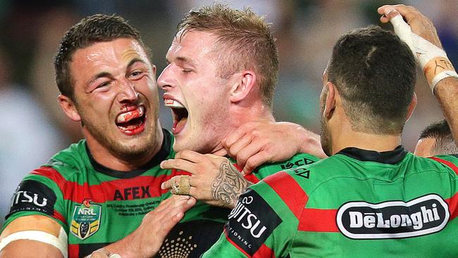 South Sydney's George Burgess celebrates with brother and tryscorer South Sydney's Sam Burgess  during the 2014 NRL Grand Final between the South Sydney Rabbitohs and the Canterbury Bankstown Bulldogs at ANZ Stadium .Picture Gregg Porteous