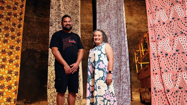 The Cairns Indigenous Art Fair will commence its 2024 program, with the satellite exhibition Not Selling Cakes: Celebrating CIAF's 15th Anniversary opening at the on Friday. CIAF Curatorial Assistant Teho Ropeyarn and Artistic Director Francoise Lane appreciate the works of CIAF's foundation artists at the Tanks Arts Centre as the exhibition is installed. Picture: Brendan Radke