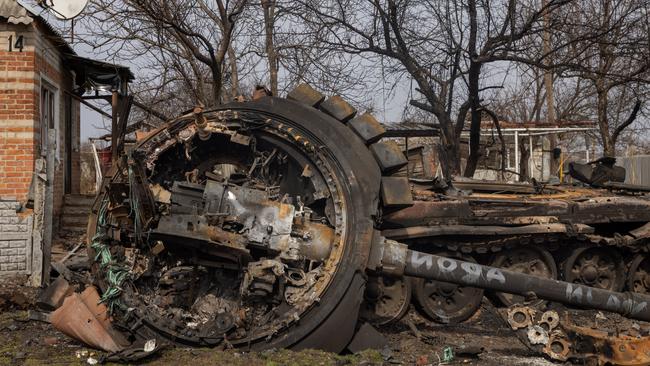 A destroyed Russian tank in front of a damaged house Malaya Rohan. A Ukrainian commander said last Friday that his forces had retaken the area. Picture: Getty Images