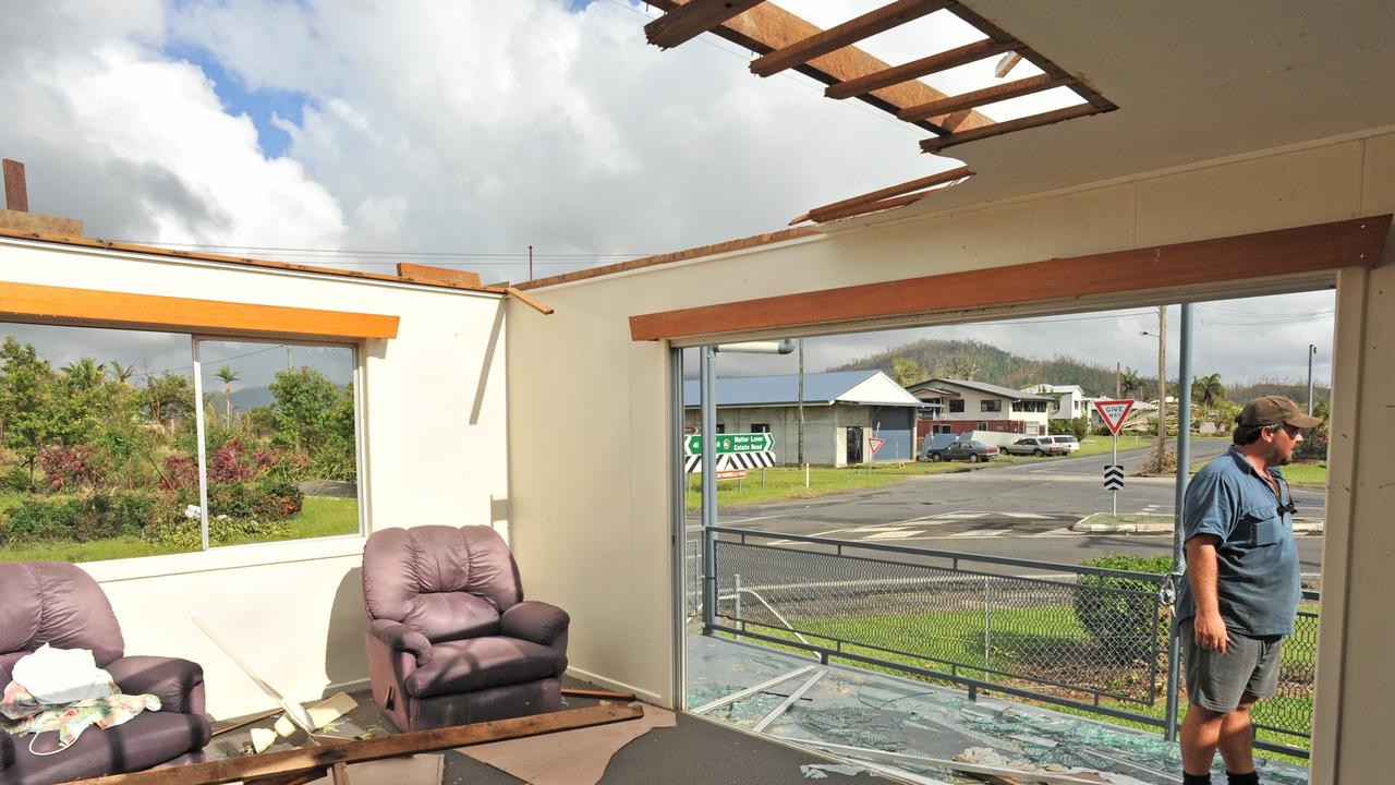 Jamie Faulks in the remains of his Silkwood home after Cyclone Yasi in 2011. Five years earlier his home was badly damaged by cyclone Larry. Picture: Evan Morgan