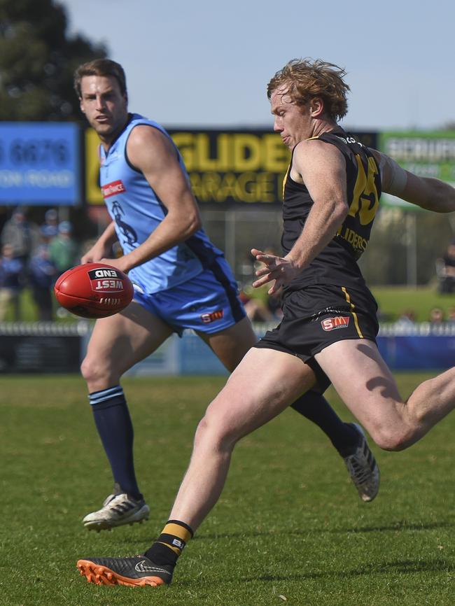 Glenelg's Josh Scott gets a kick away against Sturt on Sunday. Picture: Naomi Jellicoe