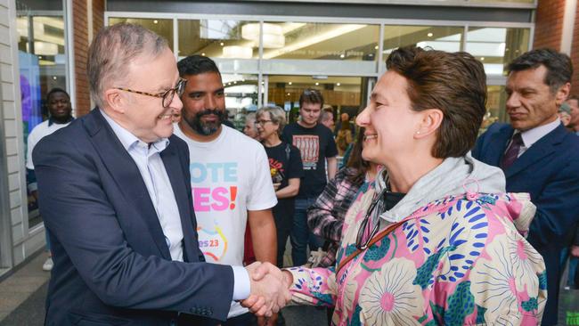 The Prime Minister, Anthony Albanese and Yes23 campaign director Dean Parkin, centre, meets local resident Rebecca Ravesi along The Parade in the eastern Adelaide suburb of Norwood. Picture: NCA NewsWire / Brenton Edwards