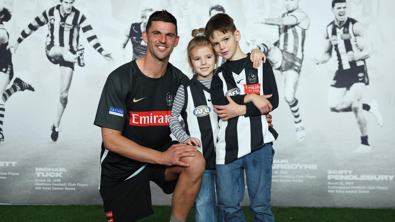 MELBOURNE, AUSTRALIA - JULY 31: Scott Pendlebury of the Magpies poses for a photograph with his children Darcy and Jax during a media opportunity at AIA Centre on July 31, 2024 in Melbourne, Australia. Scott Pendlebury is due to play his 400th AFL game this Saturday night. (Photo by Daniel Pockett/Getty Images)