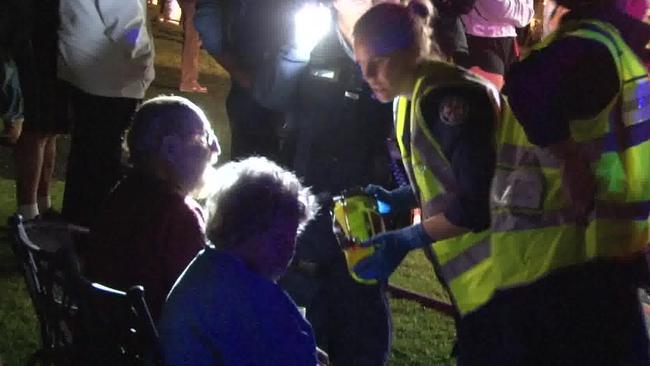 Jim and June Brennan, a couple in their 80s, being treated by emergency services outside their home in Dublin Ave, Killarney Heights. Picture: TNV