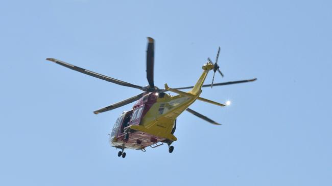 Emergency crews are conducting a land and water search for a missing fisherman. Picture: Adam Hourigan