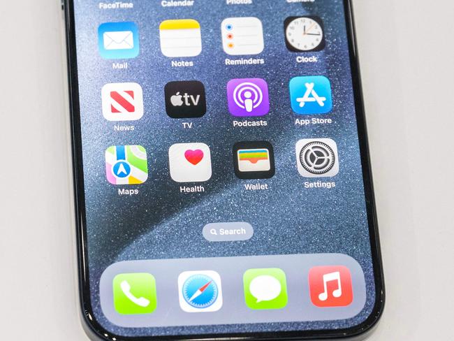 The new Apple iPhone 15 Pro models, with EU ordered USB-C charger, is displayed amongst other new products during a launch event at Apple Park in Cupertino, California, on September 12, 2023. (Photo by Nic Coury / AFP)