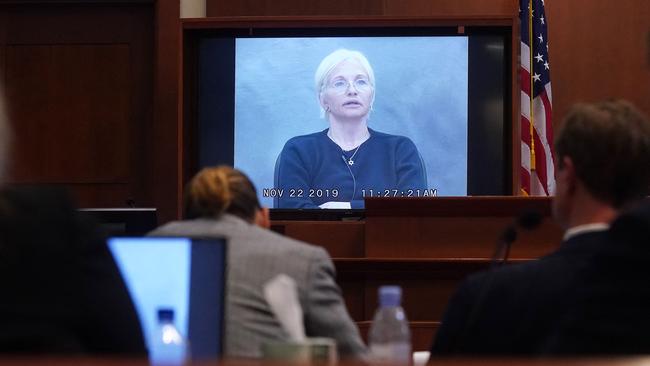 Actress Ellen Barkin appears on a monitor as a recorded testimony from 2019 is played in court. Picture: POOL / AFP