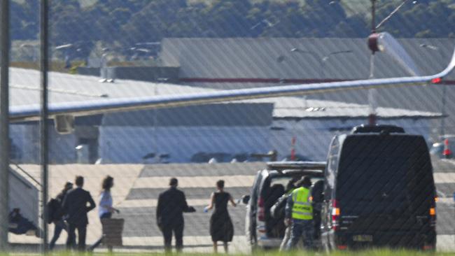 Passengers, including British-Australian academic Dr. Kylie Moore-Gilbert disembark an Australian Government jet and are met by Public Health officials and members of the Australian Defence Force (ADF). Picture: AAP