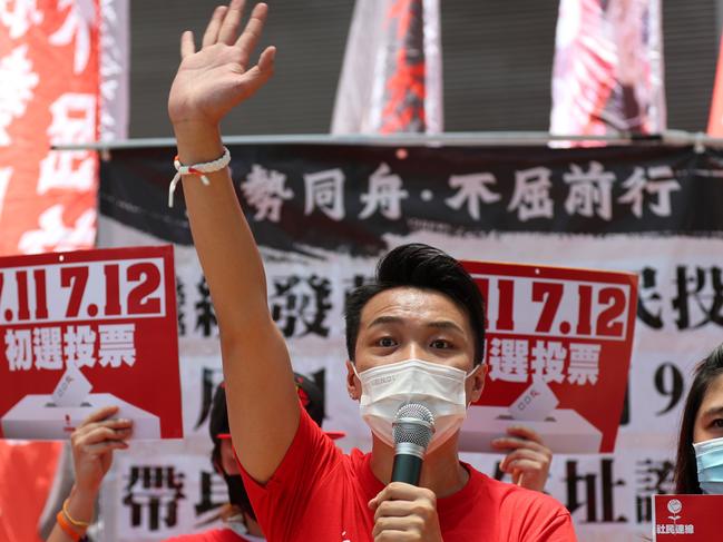 Jimmy Sham, a candidate of Kowloon West constituency, campaigns during a primary election in Hong Kong on July 11, 2020. - Voters were casting their ballots on July 11 in the primary to select the pro-democracy opposition candidates for election to the city's legislative council in September. (Photo by May JAMES / May James / AFP)