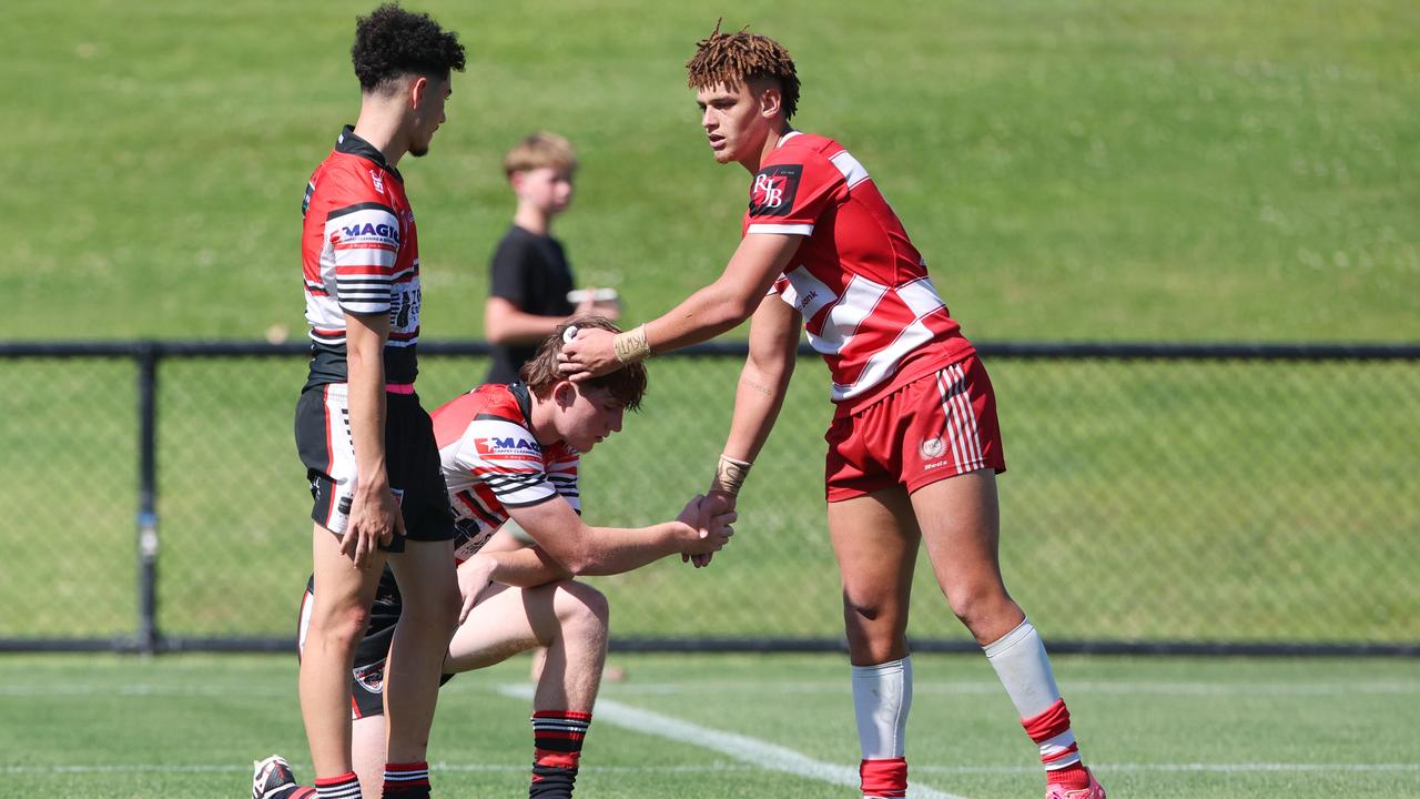 Player Jac Finigan shake hands after the NRL Schoolboy Cup grand final between Palm Beach Currumbin SHS vs Kirwan SHS at Bokarina. Picture Lachie Millard