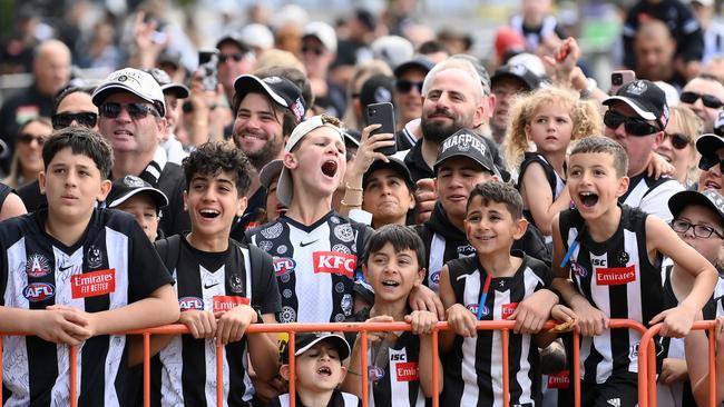 The youngest generation of Magpies supporters cheer their stars. Picture: Getty Images