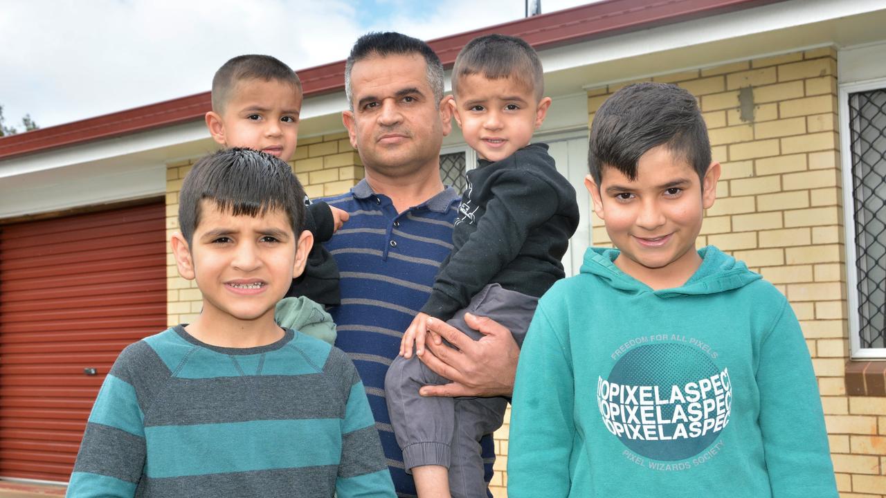 Naser Cosah, pictured here with his children Riley, Adrian, Safan and Sevan, says he is concerned for members of his Yazidi community if the federal government does not restore funding to CatholicCare for its refugee service TRAMS.